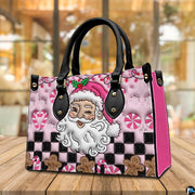 Perspective view of pink Santa handbag resting on a wooden tabletop.