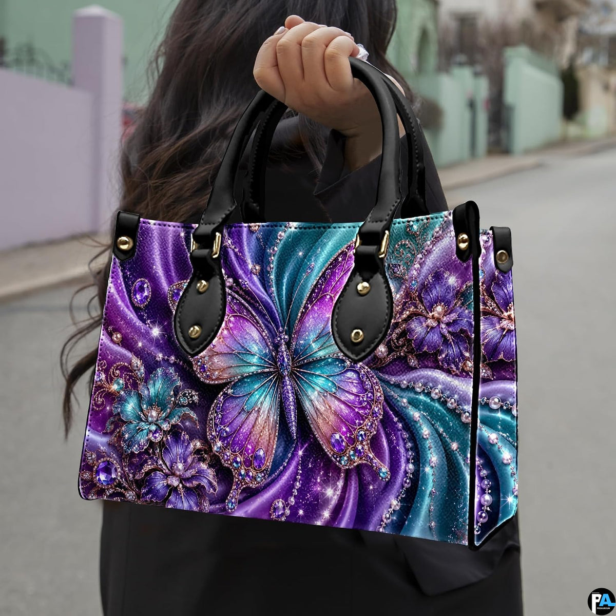 Perspective view of purple crystal butterfly handbag and wallet pair