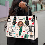 Nurse scrubs illustration handbag held outdoors showing visual scale against street setting.