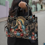Lifestyle presentation of model wearing black outerwear carrying the ornate Marian baroque frame handbag.