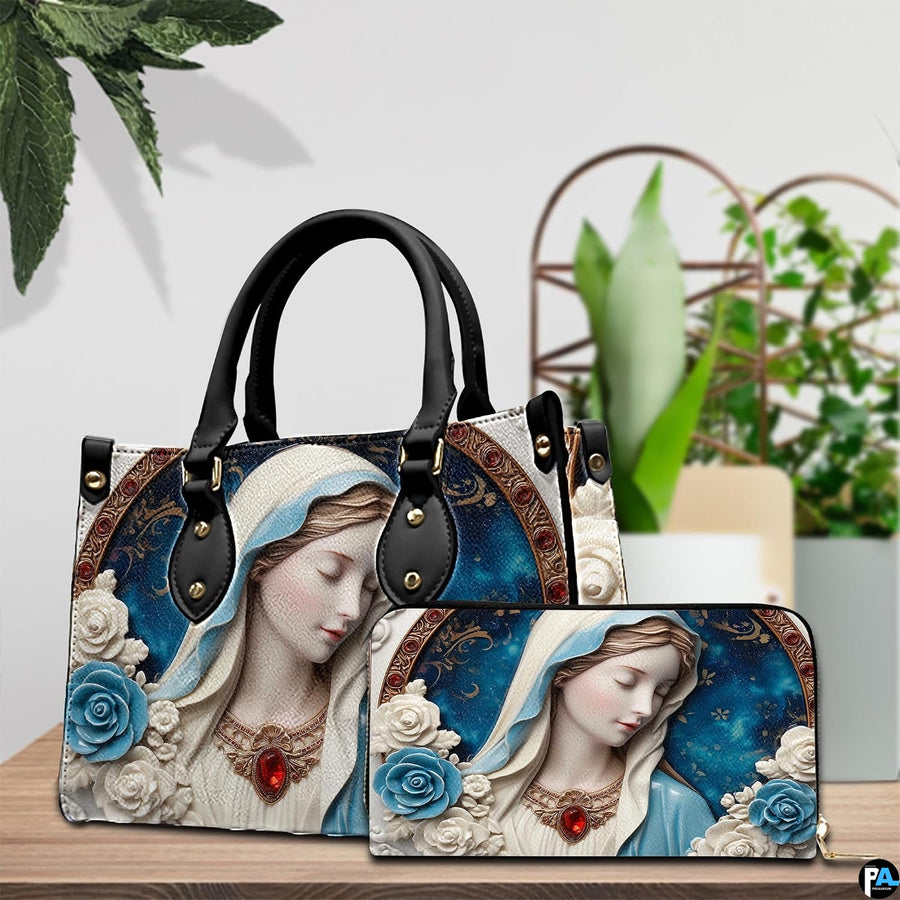 Tabletop lifestyle display showing porcelain Madonna handbag and matching wallet beside potted house plants.