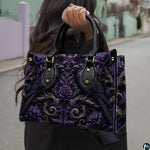 Street perspective of person holding the gothic raven art accessory highlighting rich purple damask motifs.