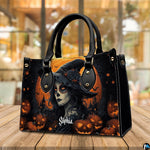 Halloween witch handbag displayed on wooden tabletop in front of sunlit window.