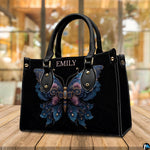 Tabletop perspective of ornate floral butterfly handbag resting on wooden surface