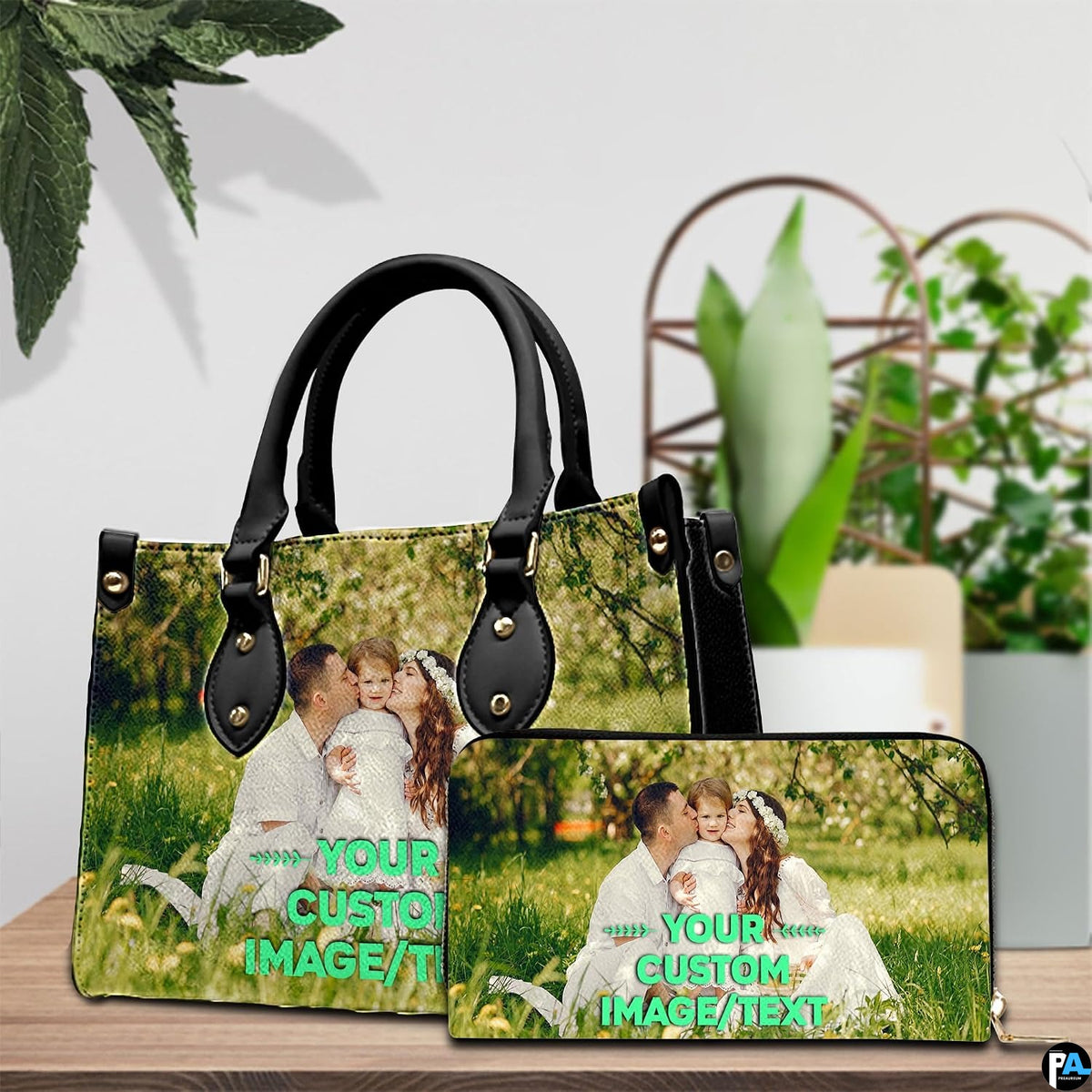 Sunny meadow family portrait handbag and wallet set displayed together on wooden tabletop.