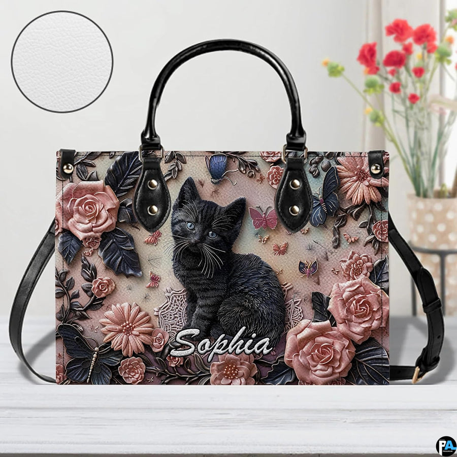 Close-up front view of matching zippered wallet showing black kitten portrait