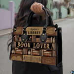 Product diagram highlighting handle buckles, removable shoulder strap, zipper pull, and lining.