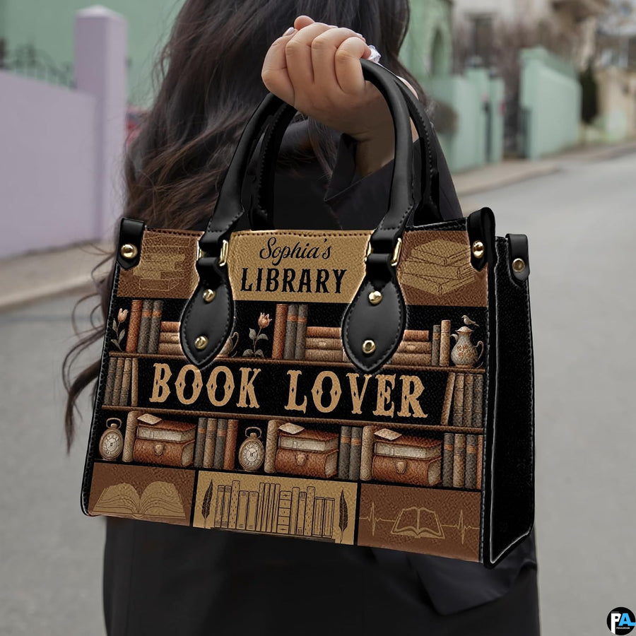 Product diagram highlighting handle buckles, removable shoulder strap, zipper pull, and lining.