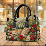 Angled tabletop perspective highlighting sleeping tabby cat graphic and colorful floral side profile.