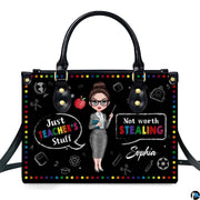 Chalkboard teacher humor handbag featuring rainbow polka dot border, apple, and school doodles.
