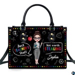 Chalkboard teacher humor handbag featuring rainbow polka dot border, apple, and school doodles.