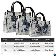 Three quarter view of structured blue porcelain butterfly handbag and matching companion piece