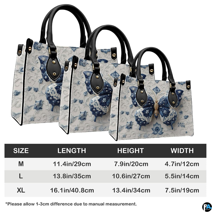 Three quarter view of structured blue porcelain butterfly handbag and matching companion piece