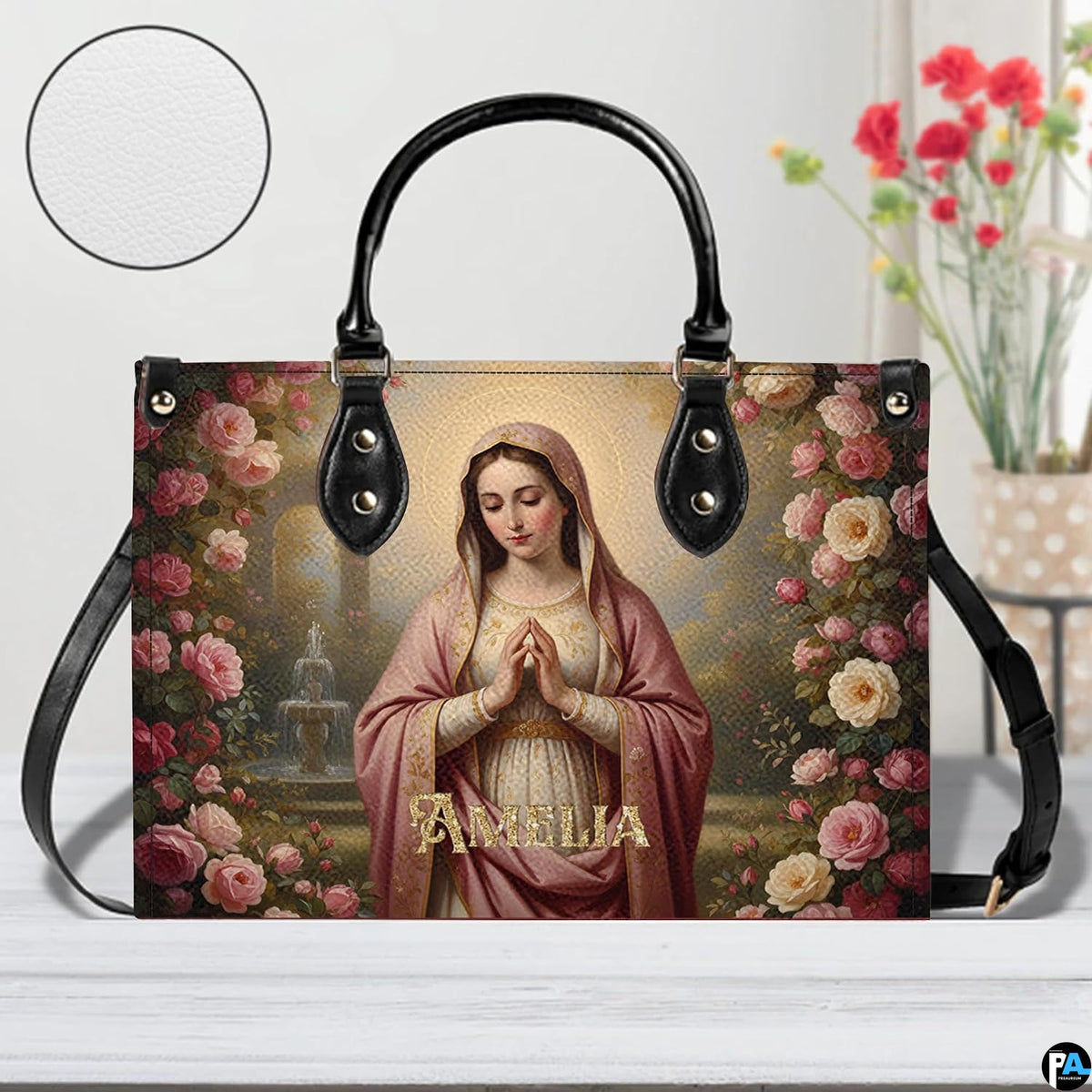 Virgin Mary rose garden handbag displayed alongside matching wallet