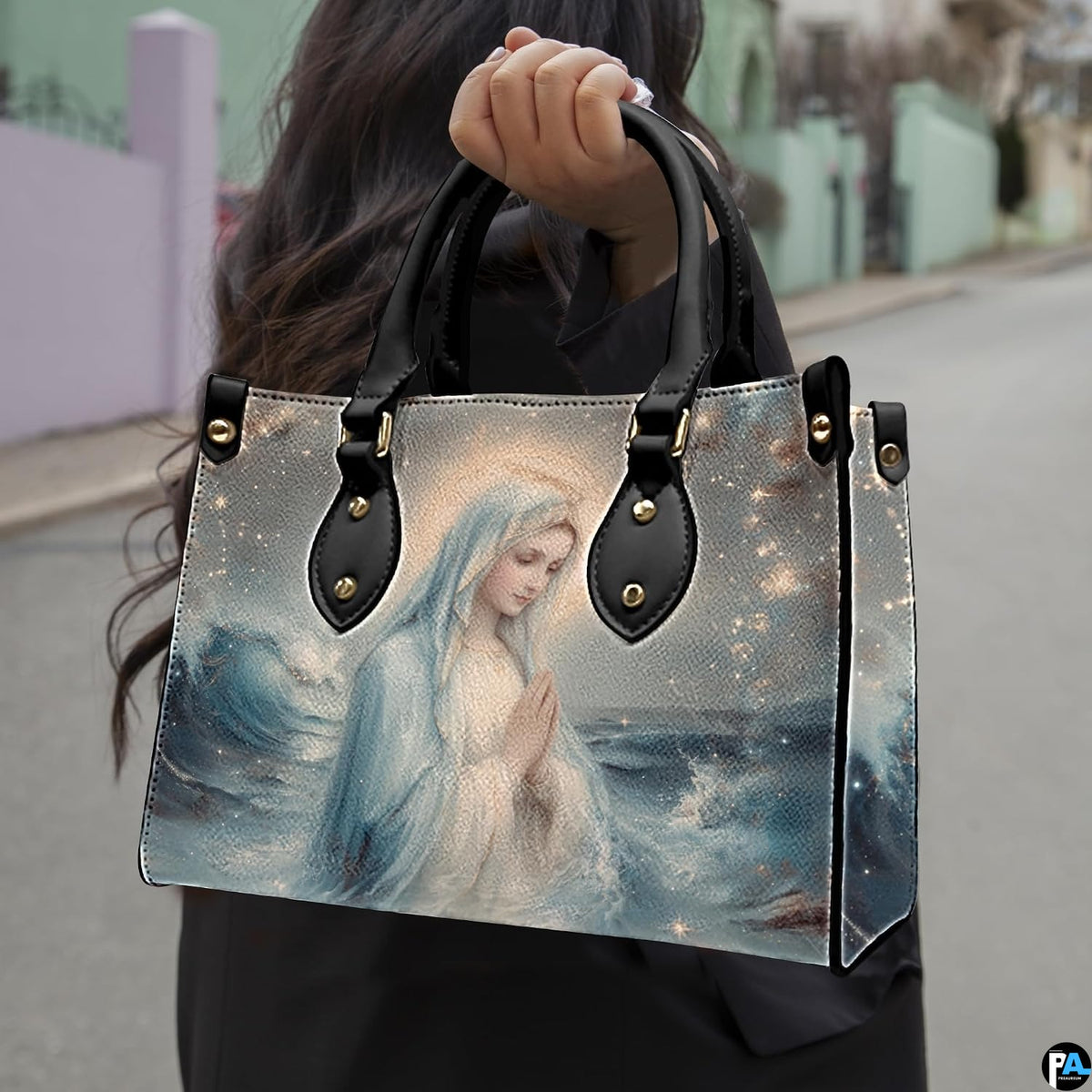 Street lifestyle view of woman carrying Stella Maris ocean wave handbag.