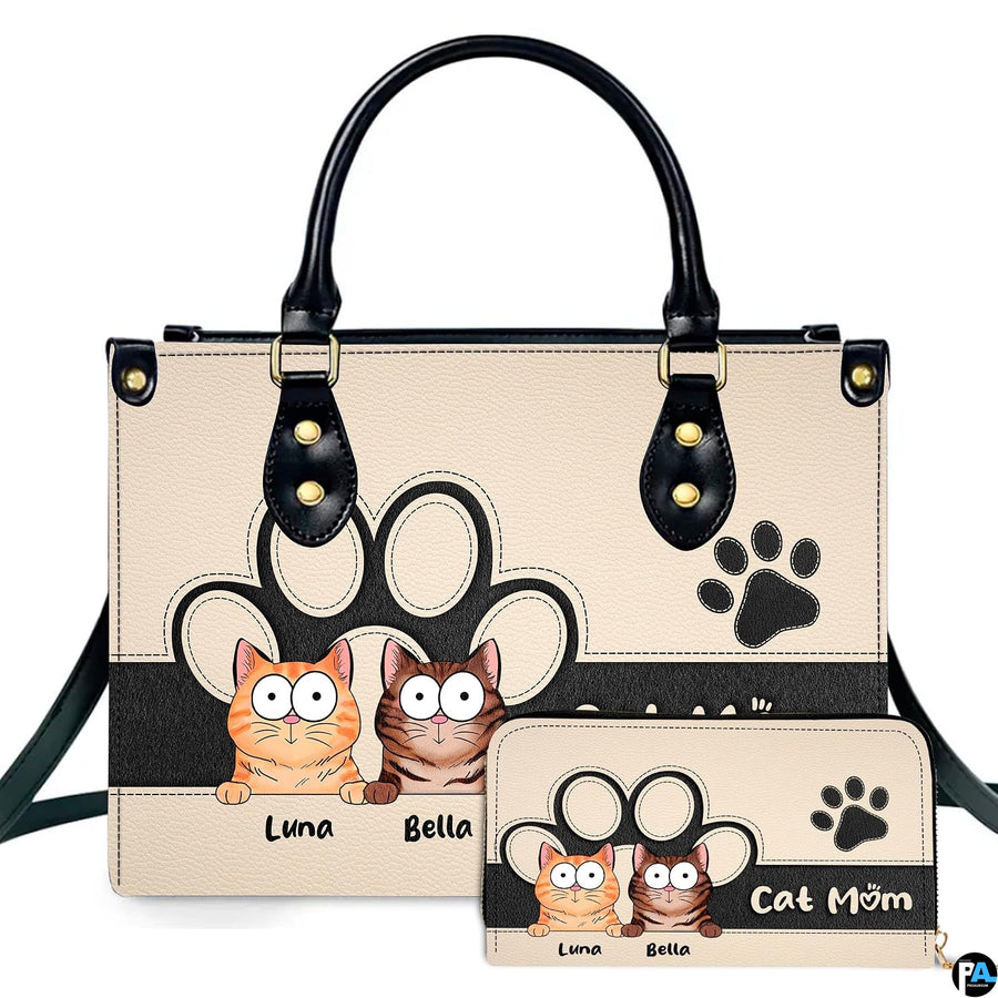 Front view of cute cartoon peeking cats handbag and matching wallet set with tabby kittens