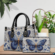 Tabletop display showing Delftware butterfly handbag and matching wallet beside indoor plants