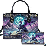 Studio front view of handbag and matching wallet with winged dragon on spellbook against full moon artwork.