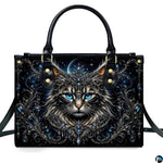 Front studio shot of crowned cat, sapphire blue eyes, crescent moon, and baroque filigree.