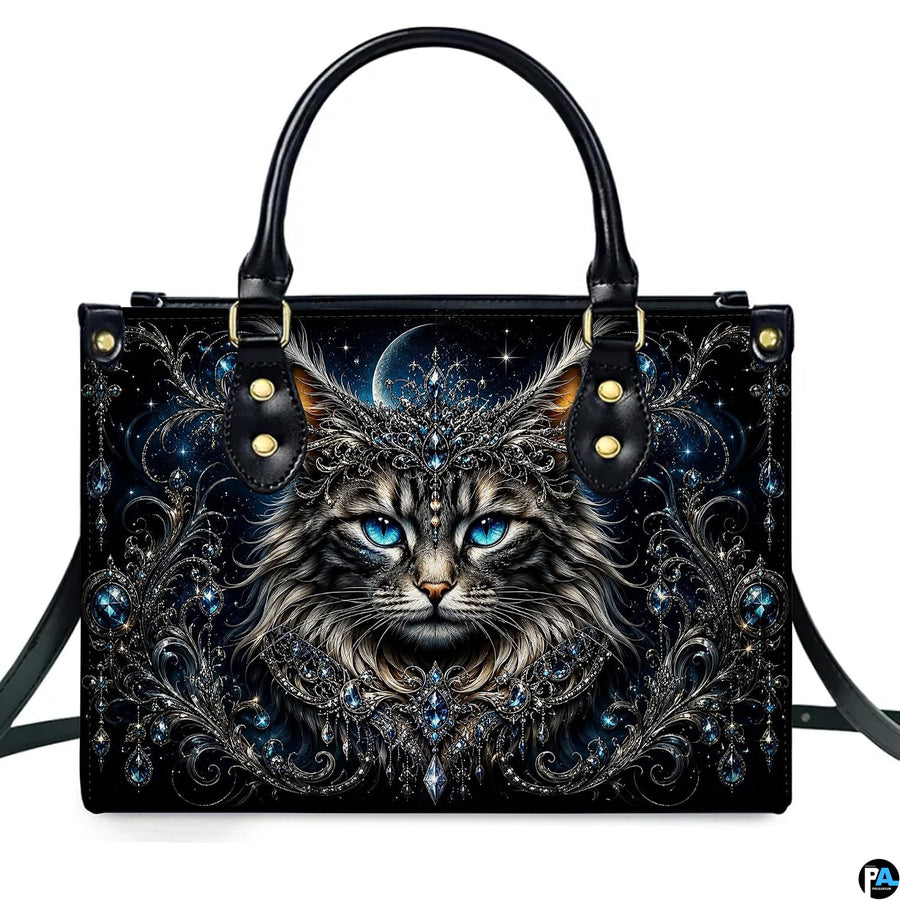 Front studio shot of crowned cat, sapphire blue eyes, crescent moon, and baroque filigree.