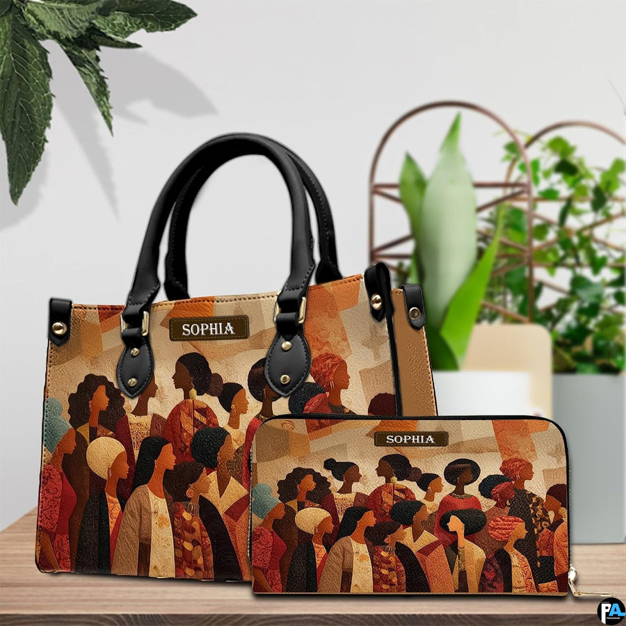 African American sisterhood profile art placed on a wooden surface beside potted interior greenery.