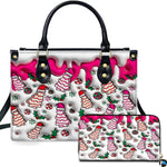 Front view of holiday tree cake handbag and matching zippered wallet with dripping pink glaze.
