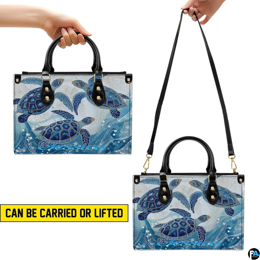 Top-down view displaying interior compartment and handles of the sea turtle handbag.