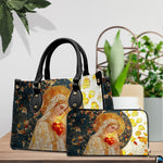 Stained glass Virgin Mary handbag and matching wallet displayed on table next to houseplant.