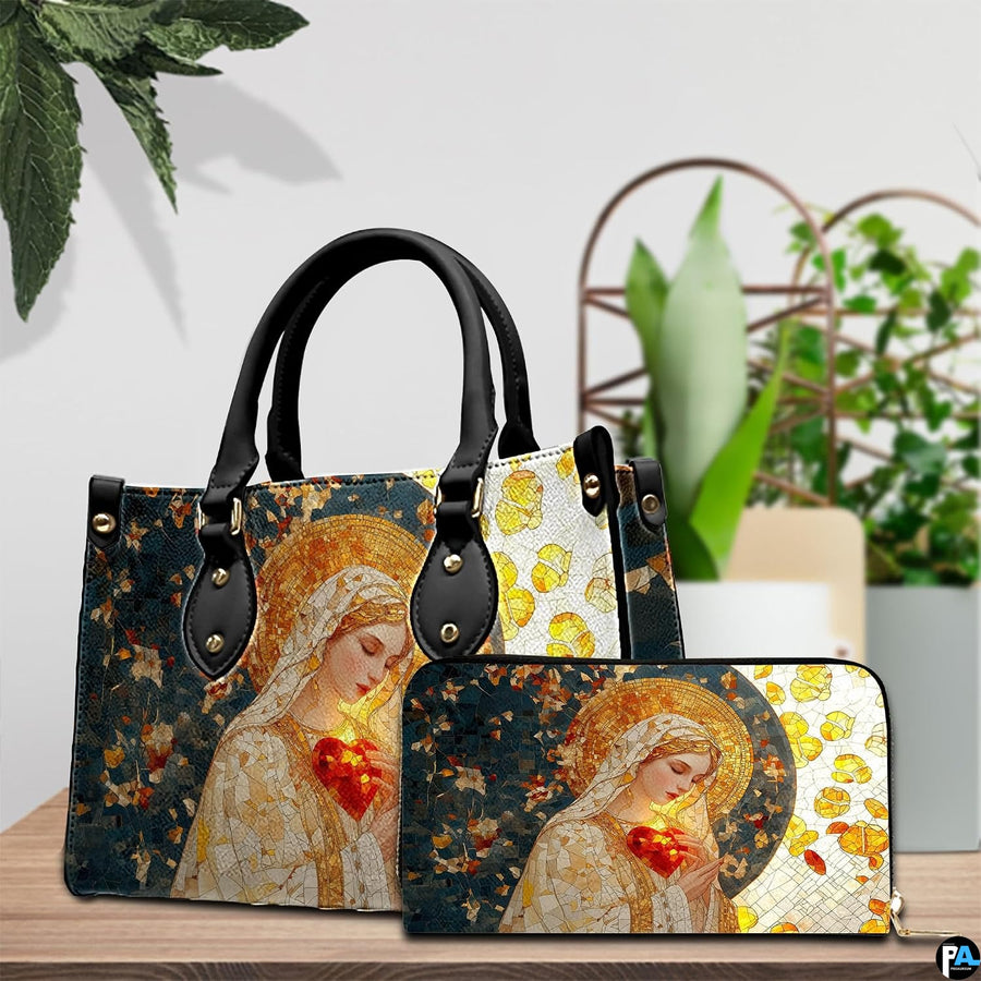 Stained glass Virgin Mary handbag and matching wallet displayed on table next to houseplant.