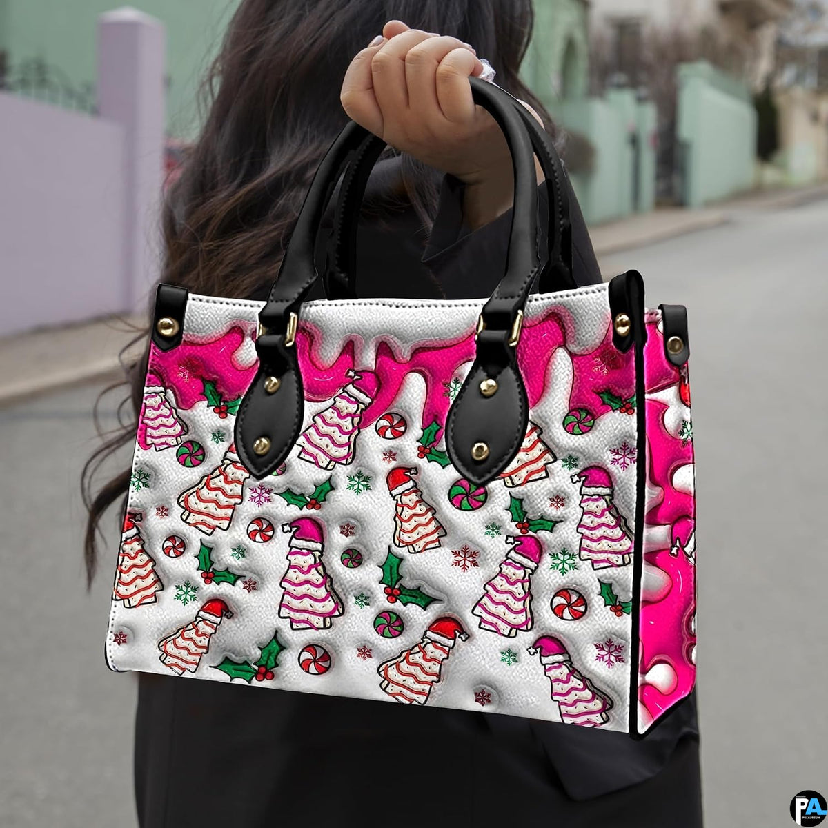 Holiday tree cake handbag displayed in studio setting with circular texture swatch inset.