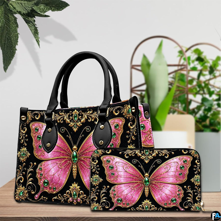 Lifestyle tabletop view showing pink jeweled butterfly artwork placed beside decorative indoor house plants.