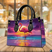 Side profile perspective of the handbag showing structured side panel and hardware.