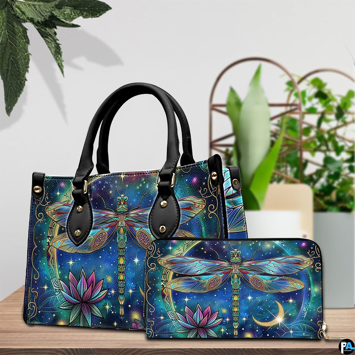 Side profile of celestial dragonfly handbag showing continuous starry sky and floral motif along gusset