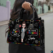 Angled front view displaying the chalkboard illustration panel and black carrying handles.