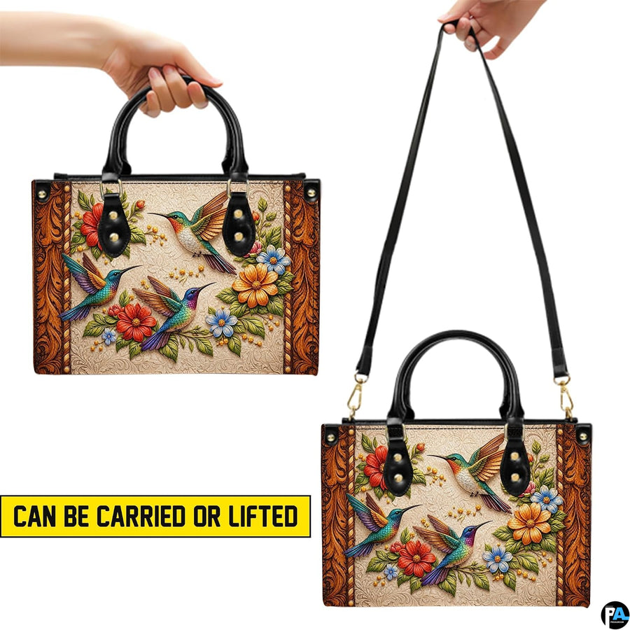Handbag displayed held by top handle and detachable shoulder strap demonstrating carrying styles.