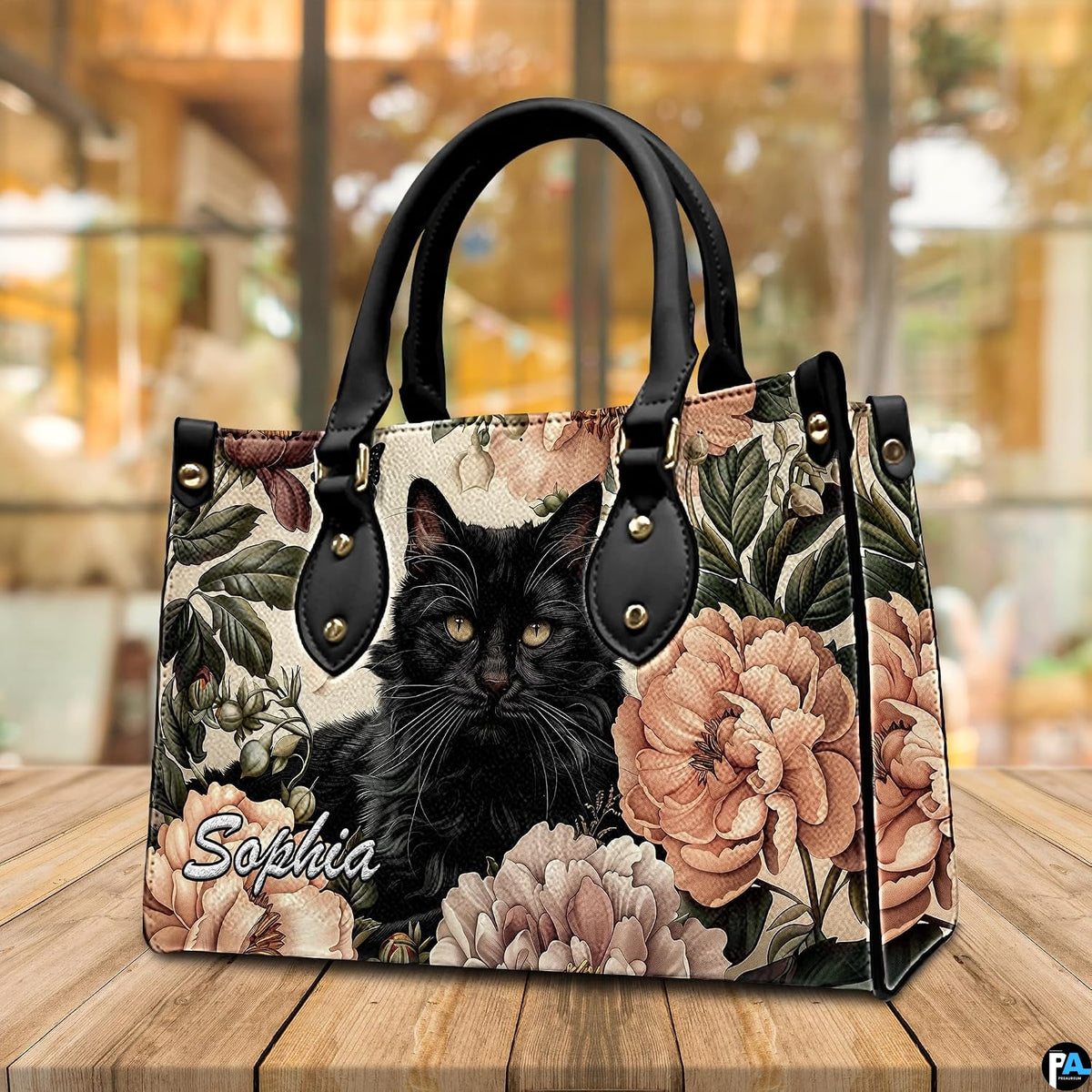 Presentation showing holding and shoulder carrying options for fluffy black cat art graphics.
