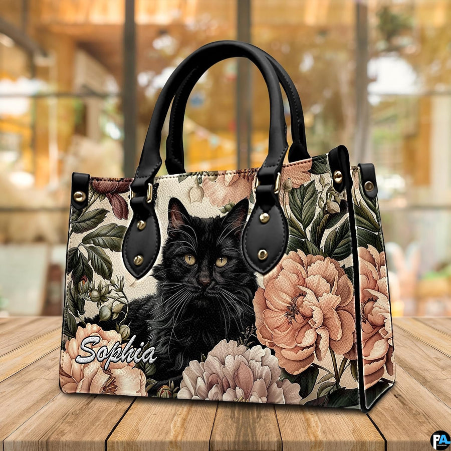Presentation showing holding and shoulder carrying options for fluffy black cat art graphics.