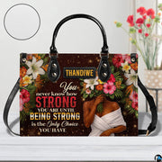 Rear view showcasing shimmering bronze surface accented by vibrant floral borders.
