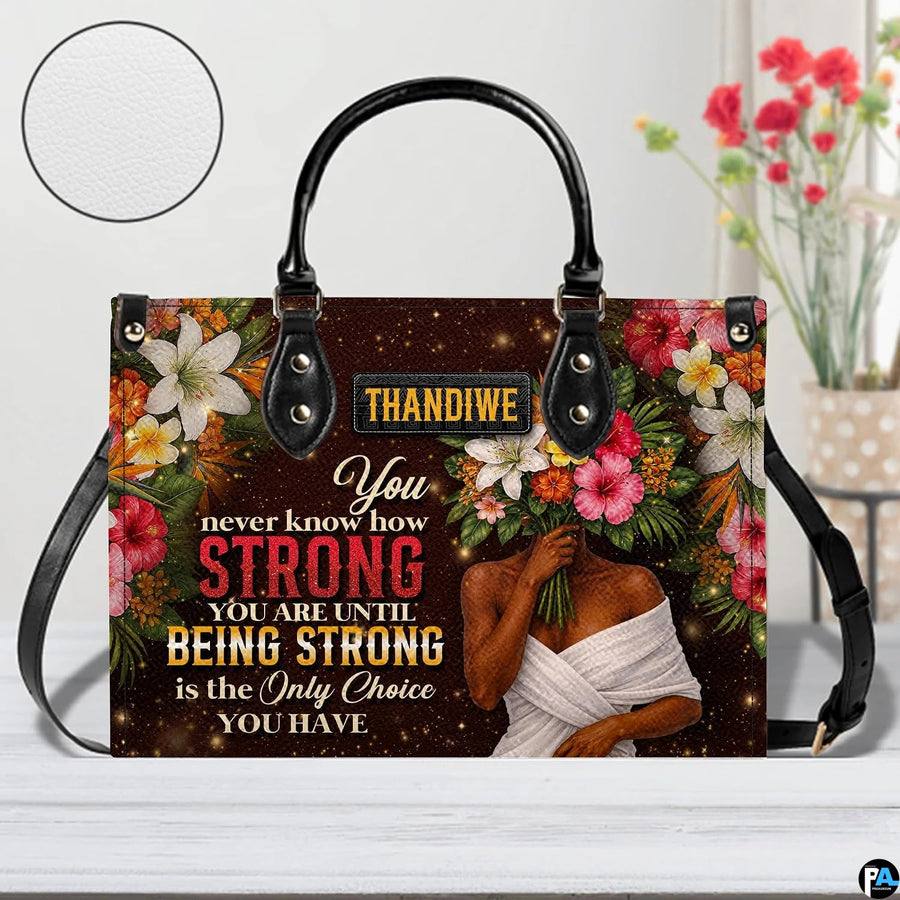 Rear view showcasing shimmering bronze surface accented by vibrant floral borders.