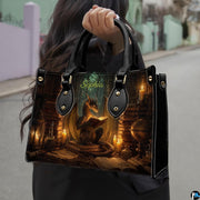 Side profile of alchemist dragon handbag showing clean seams and dark study book pattern